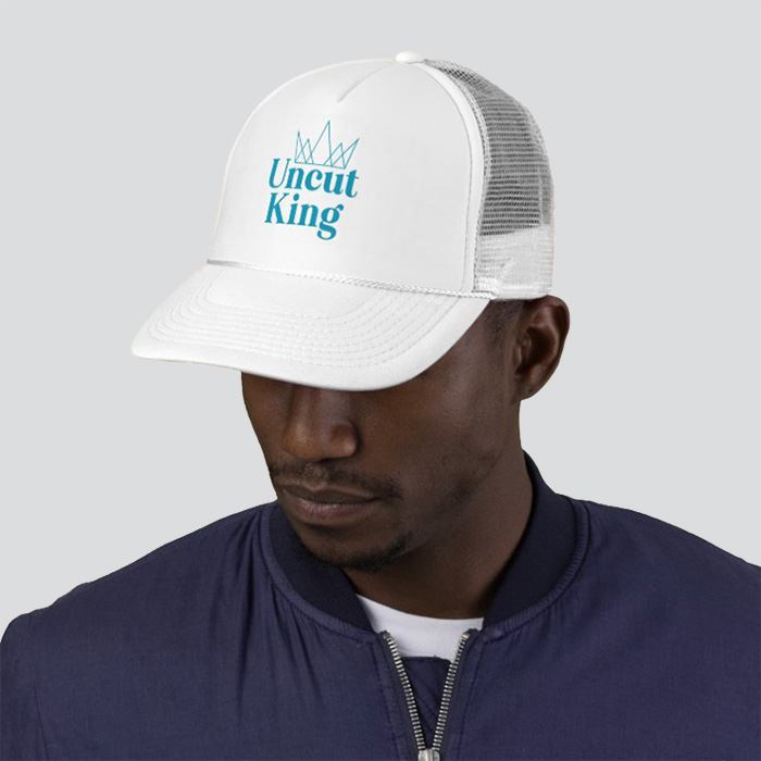 White hat that says 'Uncut King' with a crown